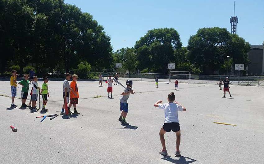 Father Justin Fulton, assistant pastor at the Cathedral of the Risen Christ in Lincoln, and teacher Mr. Scott Svatos hosted ‘Wiffle ball Wednesday’ at the Cathedral of the Risen Christ in Lincoln July 13. (Courtesy photo)